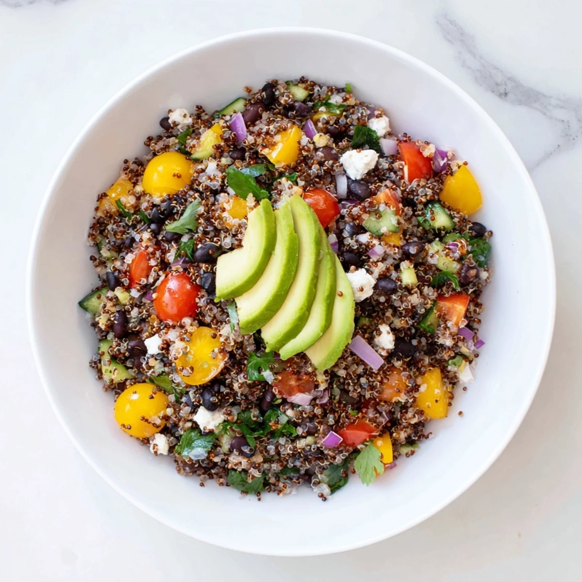 Vibrant Poppy-Bright Colorful Quinoa and Black Bean Salad, full of fresh vegetables and a poppy seed dressing.