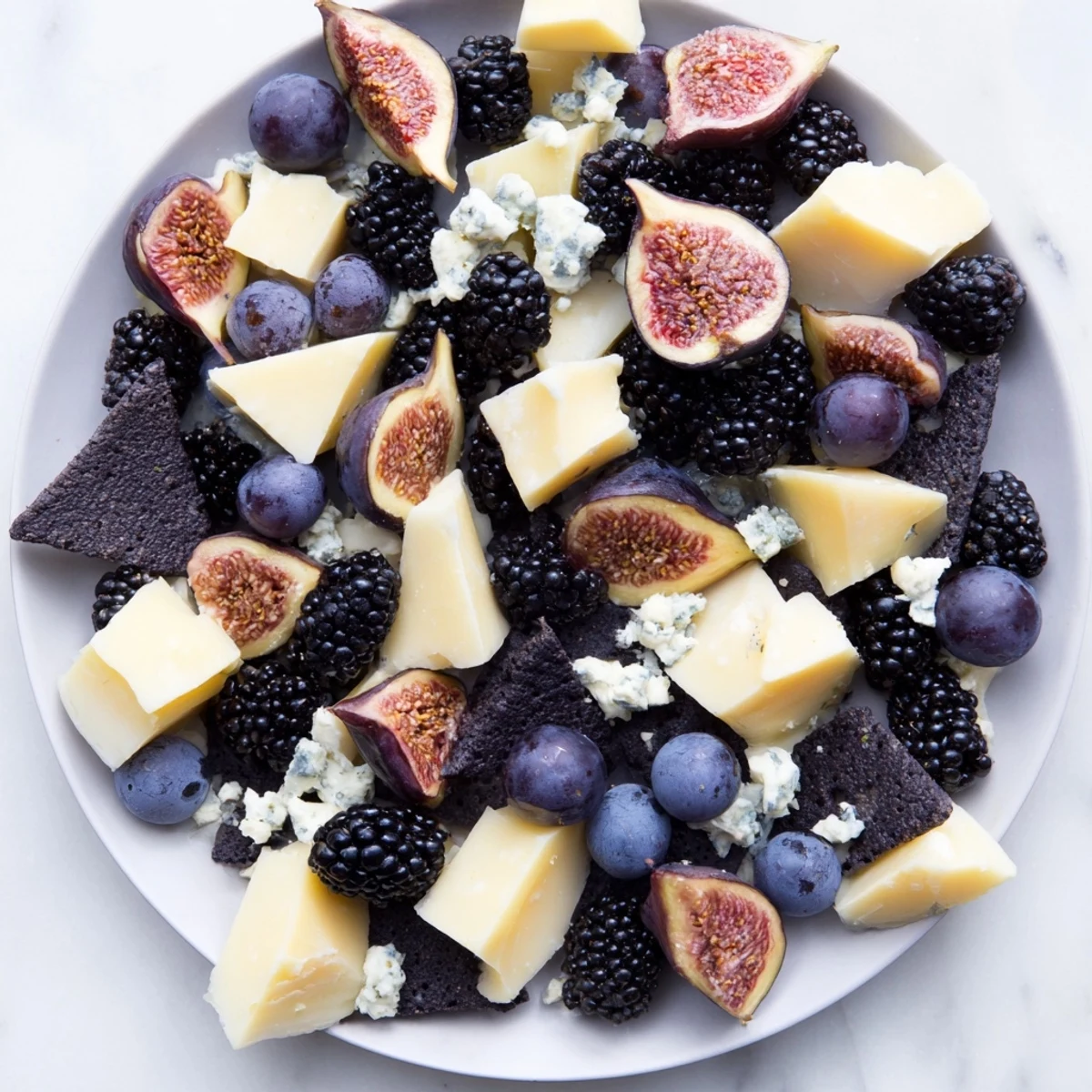 Midnight Sky cheese board, a beautiful and vibrant appetizer ready to serve with dark fruits.