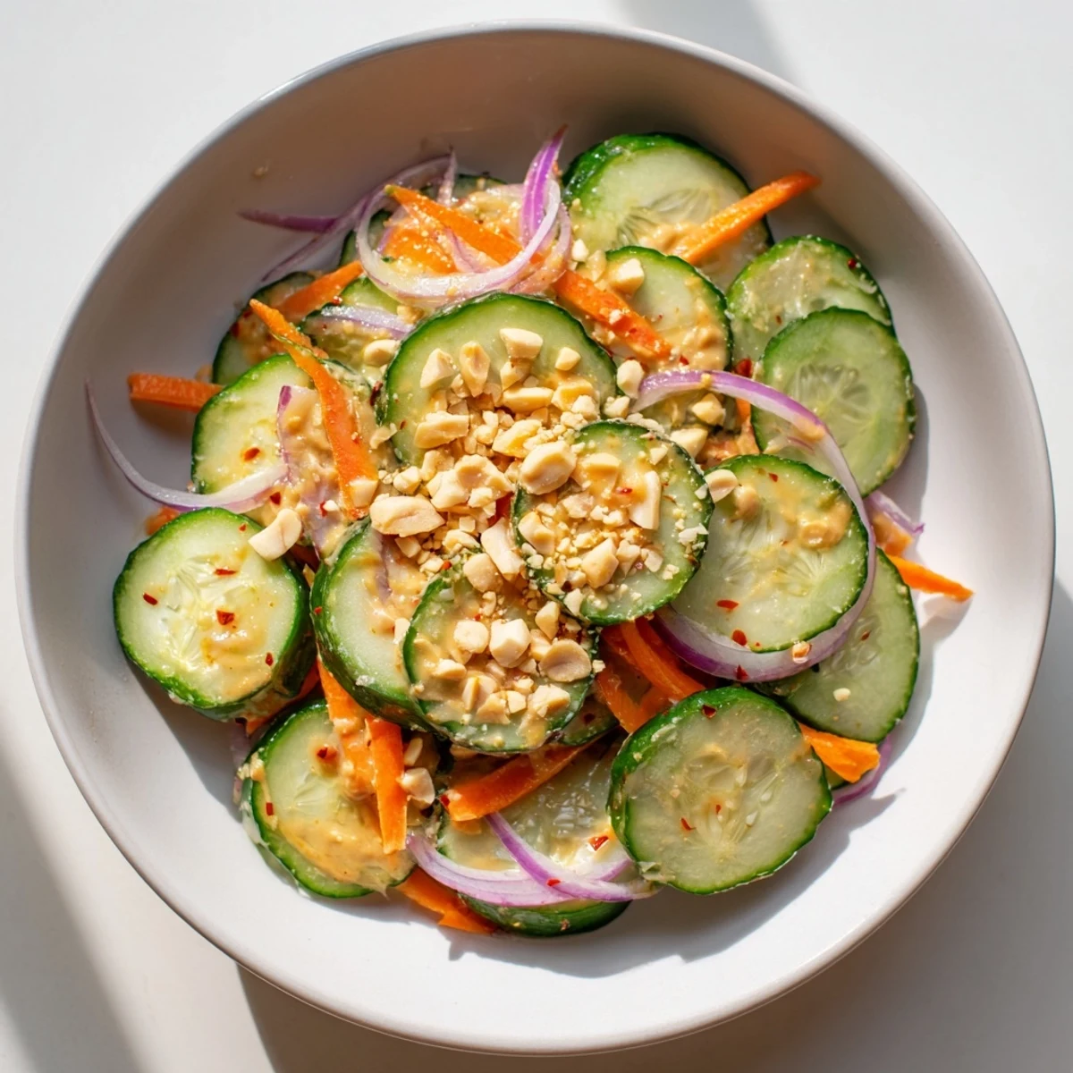 Crisp, colorful Thai-Style Peanut Cucumber Salad, with fresh cilantro and crunchy peanut topping.