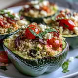 Vibrant stuffed bell peppers with quinoa and fresh herbs, baked until tender and golden, perfect for a healthy vegetarian dinner.