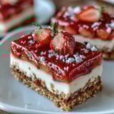 Vibrant strawberry lemonade bars with a golden shortbread crust, perfect for summer picnics and parties.