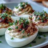 Deviled Eggs with Paprika and Chives, tangy Dijon-mayo filling topped with vibrant chives for a classic party appetizer.