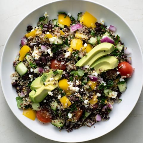 Delicious, refreshing Poppy-Bright Colorful Quinoa and Black Bean Salad, tossed and ready to eat!