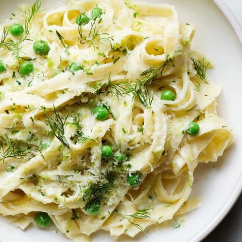 This inviting image shows the finished Creamy Dill Pasta dish, ready for serving with optional garnishes.