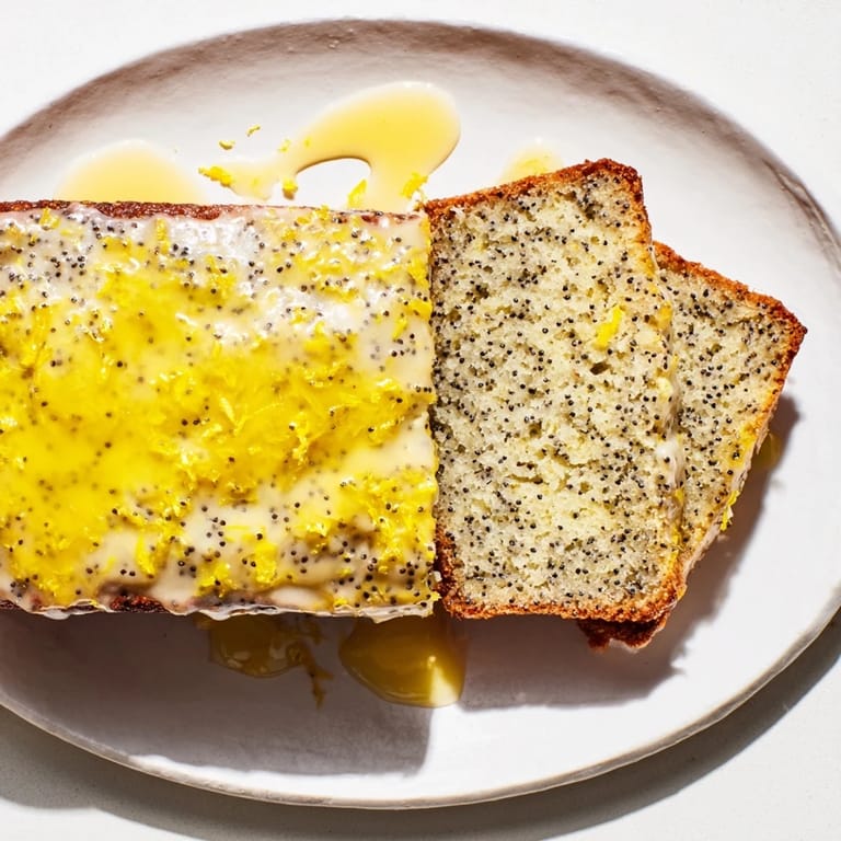 Golden-brown Glazed Lemon Poppy Seed Cake, a delicious dessert with a bright lemon flavor, perfect with tea.