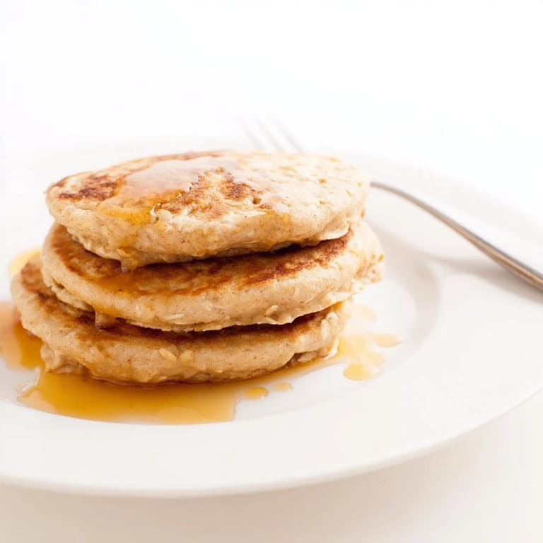 Close-up on the soft texture of banana oat pancakes, perfect for gluten-free diets.