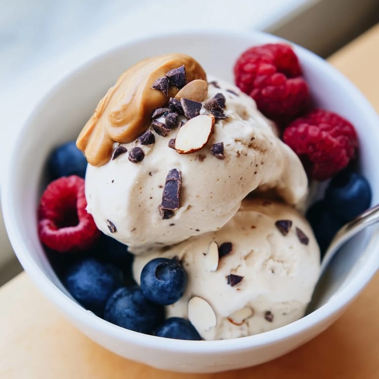 Homemade protein ice cream bowl, showing a perfect texture and tempting toppings for a simple dessert.