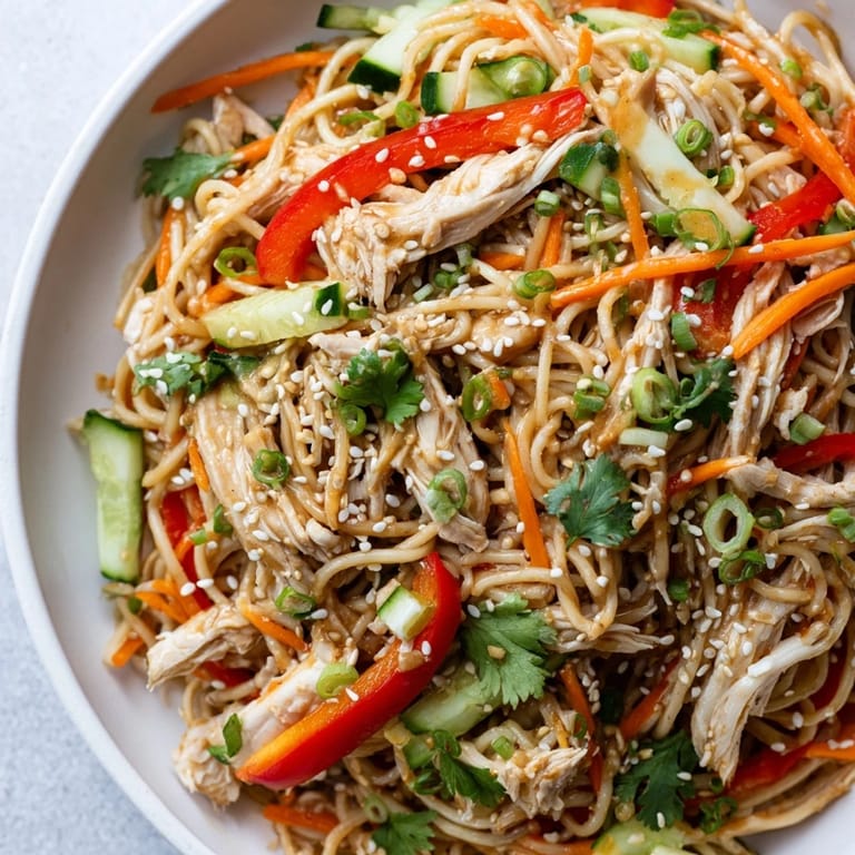 Imagine a refreshing bowl of Chilled Chicken Noodle Salad, a perfect meal on a hot day.