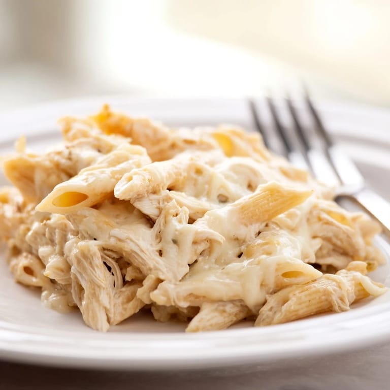 A hearty serving of Chicken Ranch Pasta Bake featuring tender chicken, creamy ranch sauce, and bubbly cheese topping.