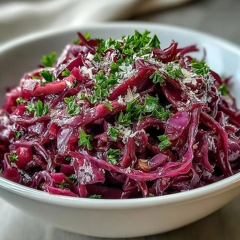 Colorful Red Cabbage Coleslaw With Apple and Parmesan, featuring crunchy cabbage ribbons and sweet apple slices ready to serve.